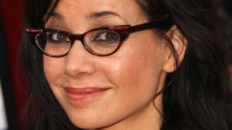 Janeane Garofalo smiles