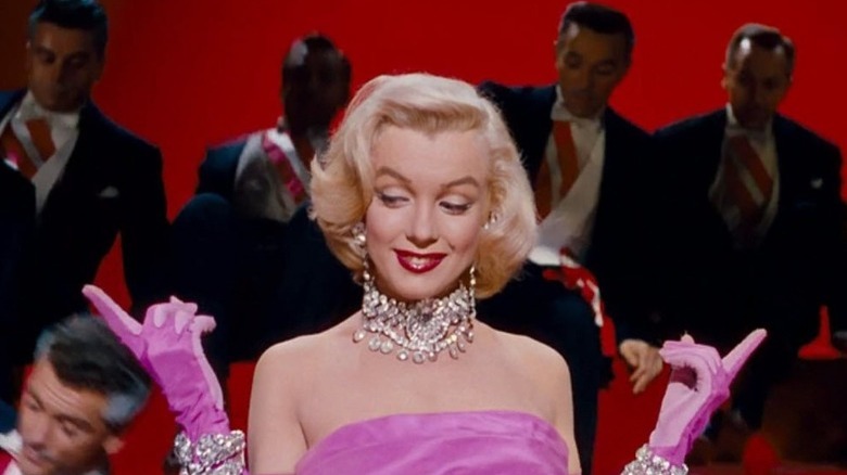 Marilyn Monroe smiling pink dress
