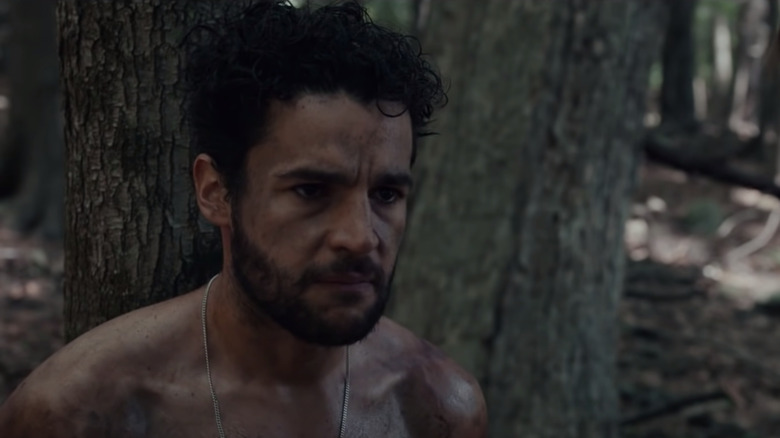 Christopher Abbott tied to tree