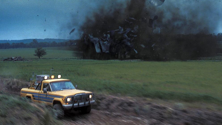 Truck drives away from tornado