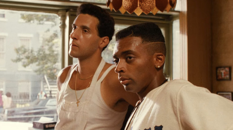 Serious Spike Lee and John Turturro look off camera