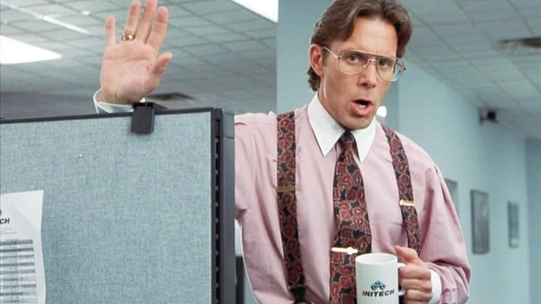 Gary Cole waves over cubicle