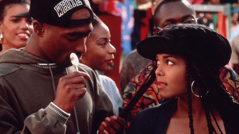 Tupac Shakur and Janet Jackson look at each other