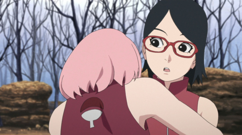 Sakura hugs Sarada after battle