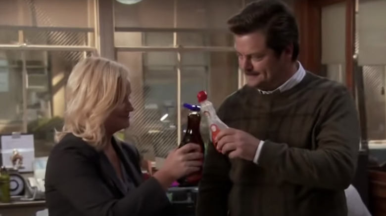 Leslie and Ron clinking syrup