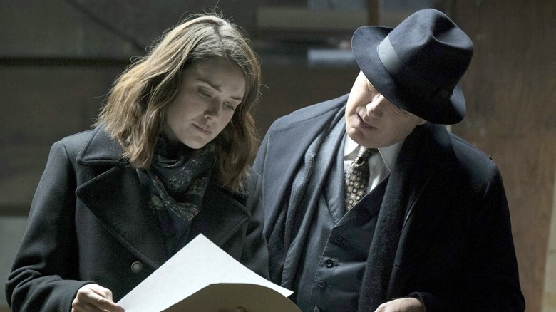 Red looks over Keen's papers The Blacklist