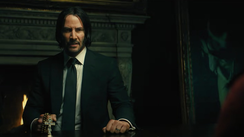 John Wick holding cross