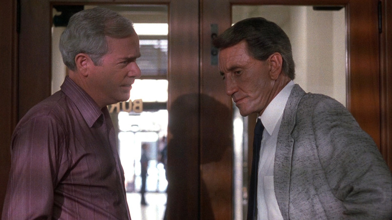 Seaver talks to another detective