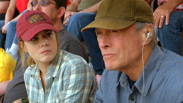 Clint Eastwood and Amy Adams watch baseball