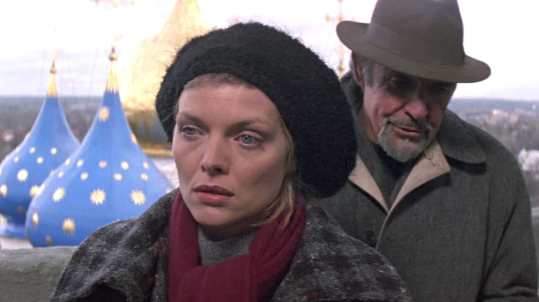 Sean Connery stands behind Michelle Pfeiffer