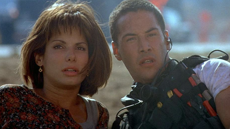 Keanu Reeves, Sandra Bullock on ground in Speed