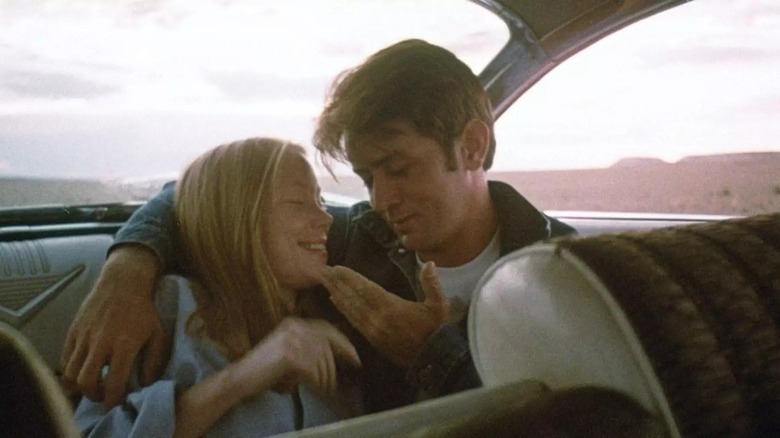 Martin Sheen and Sissy Spacek playing cute in a car