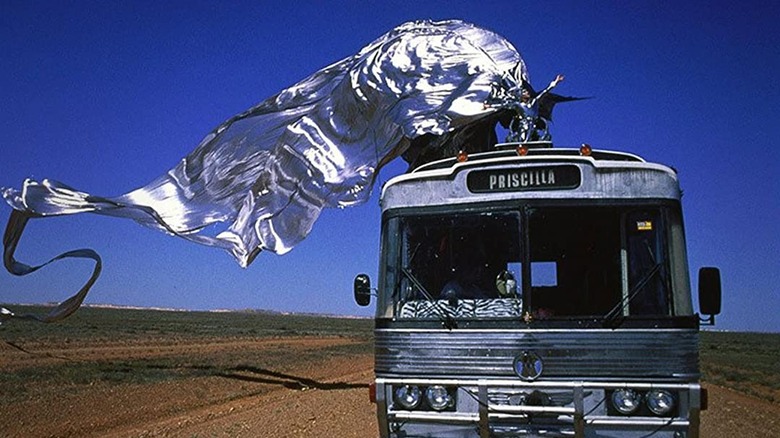 Drag queen performing atop a bus