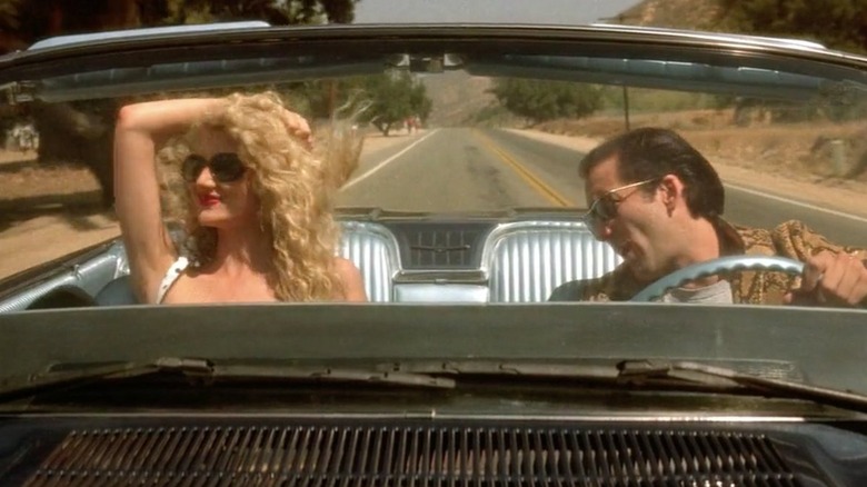 Laura Dern and Nicolas Cage driving an open-top car