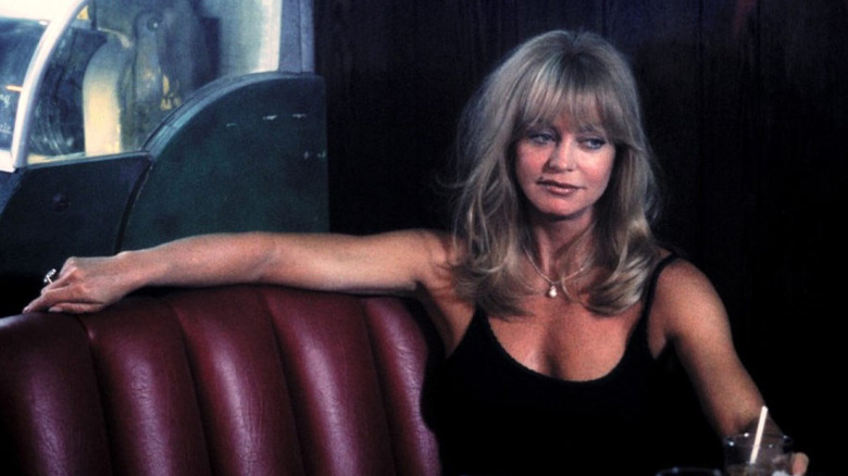 Goldie Hawn sits at bar