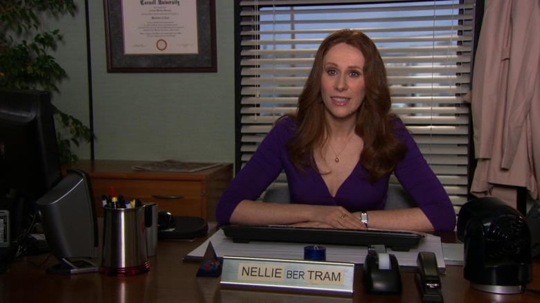 Nellie Bertram at desk