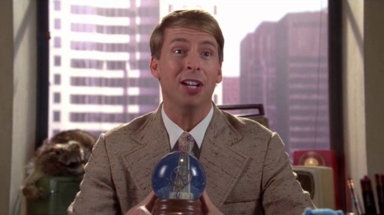 Kenneth Parcell holding a snowglobe