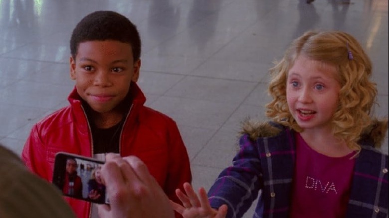 Terry and Janet greet their new parents in the airport