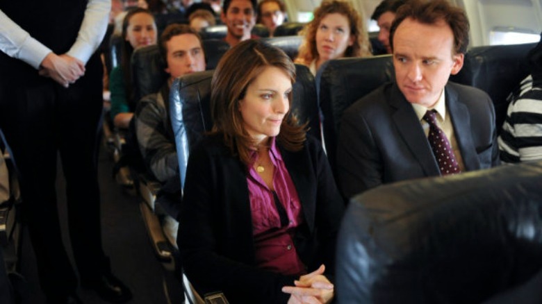 Liz Lemon talks to her seatmate on plane