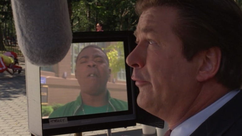 Jack Donaghy speaking into microphone