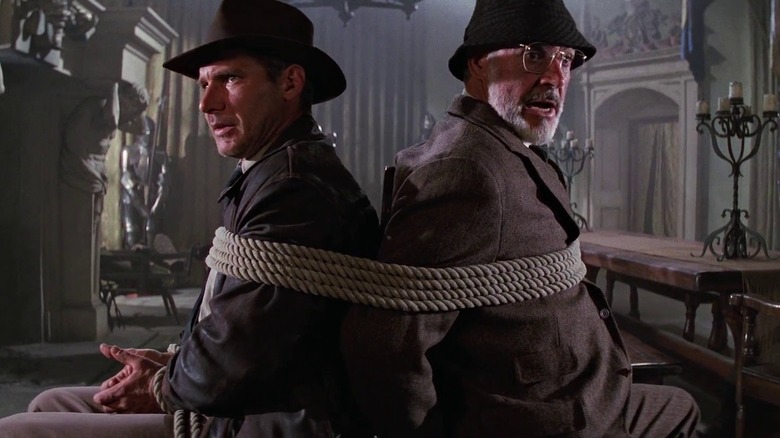 Indiana Jones and his father tied together