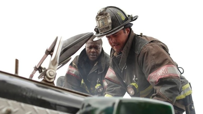 A firefighter extricates a victim Chicago Fire