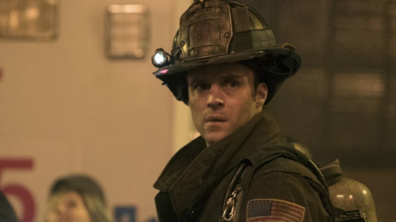 A firefighter looks right Chicago Fire