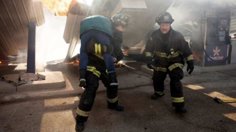 Two firefighters carry a victim Chicago Fire