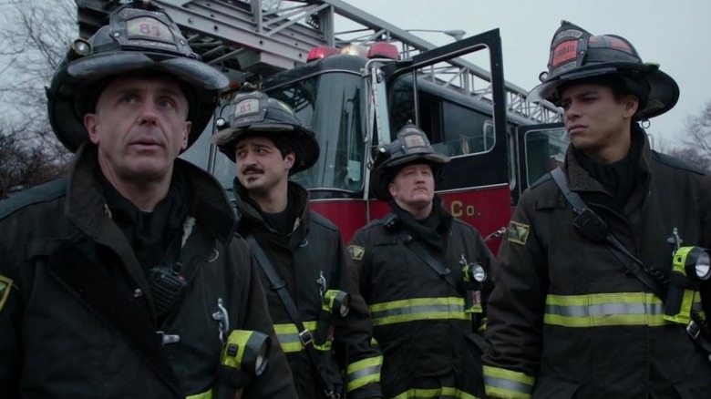 A firefighter looks over a victim Chicago Fire