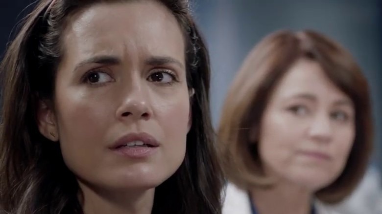 Chicago Med Torrey DeVitto looks over her shoulder