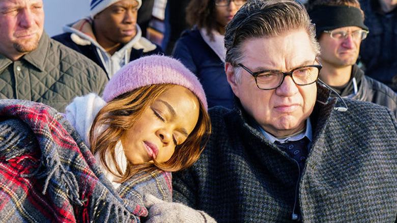 Chicago Med Paula Newsome leans her head on Oliver Platt's shoulder