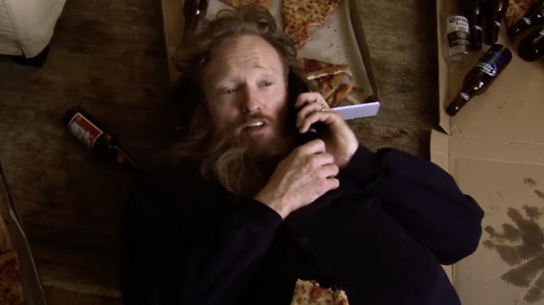 Conan O'Brien lying on pizza