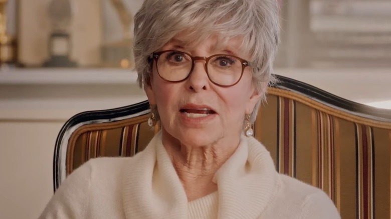 Rita Moreno sitting on ground