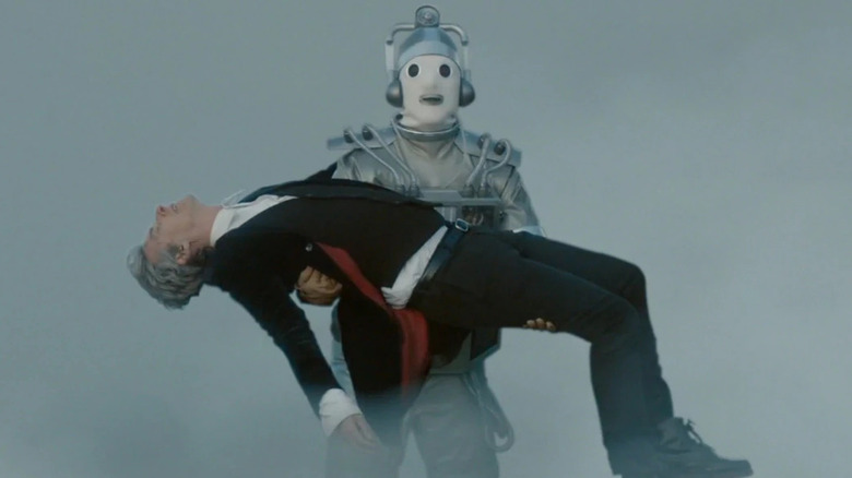 Bill as a Cyberman carries the Doctor