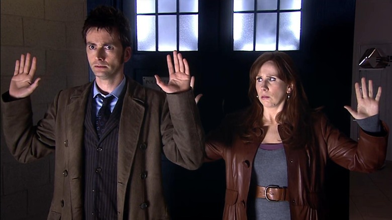 The Doctor and Donna put their hands up