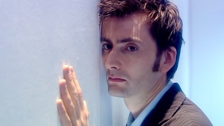 The Doctor touches a wall