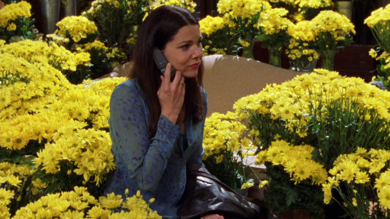 Lorelai surrounded by daisies