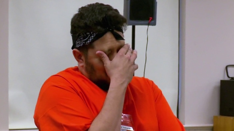 Sal with hand covering eyes