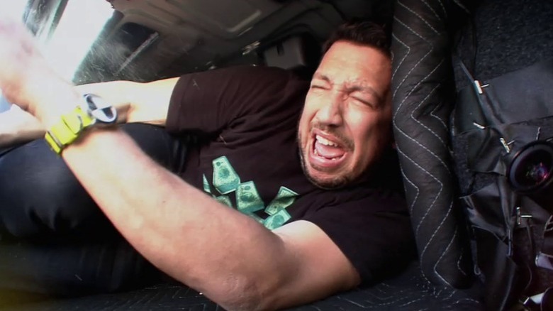 Sal laying in trunk yelling