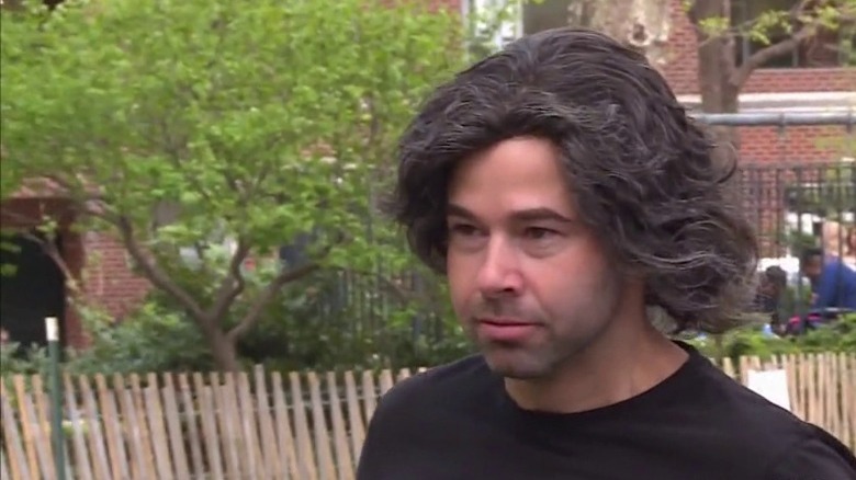 Murr wearing wig smiling