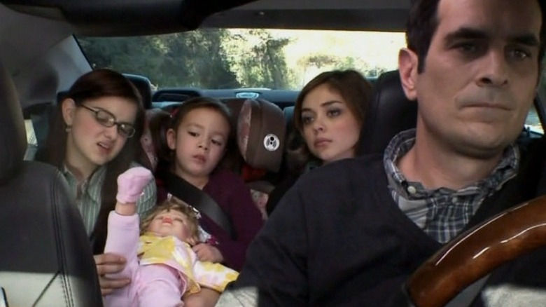 Phil, Alex, Lily, and Haley in car