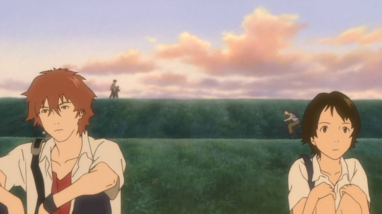 Chiaki and Makoto sitting in field