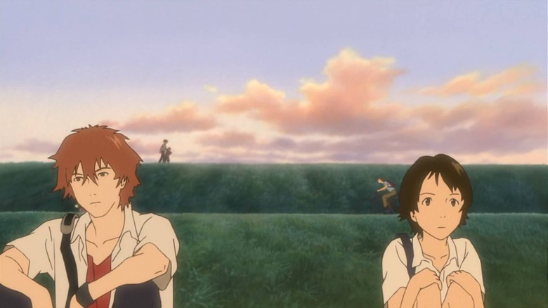 Chiaki and Makoto sitting in field