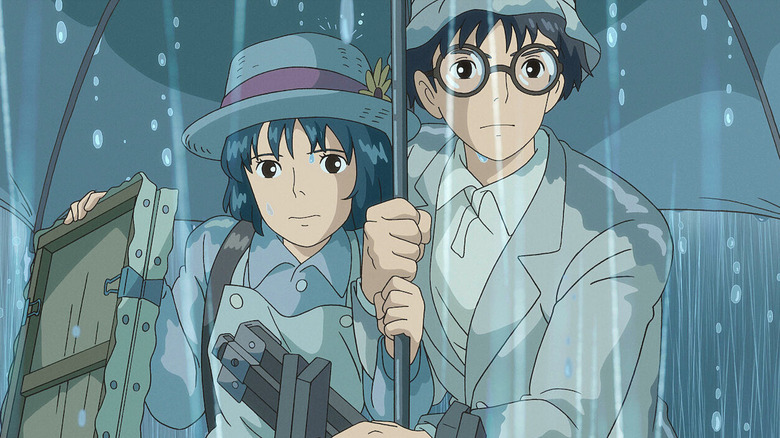 Jiro and Naoko under umbrella