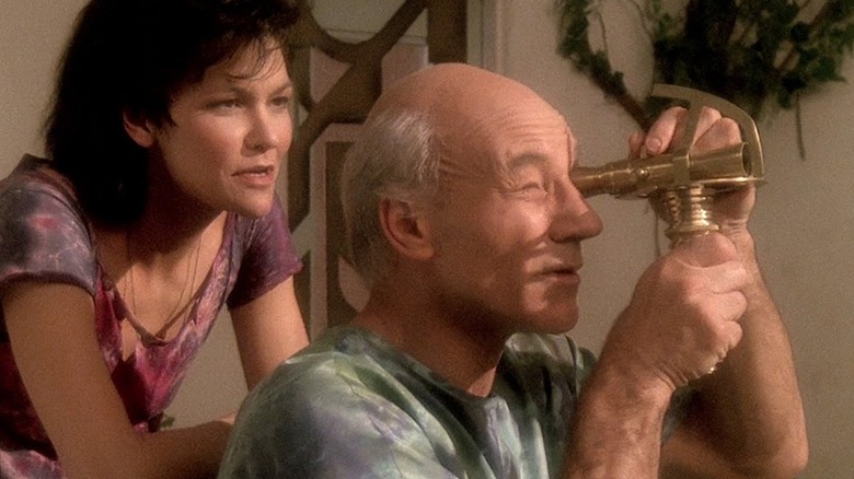 Picard looks through a telescope