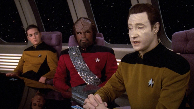 Data, Worf, and Wesley at a table