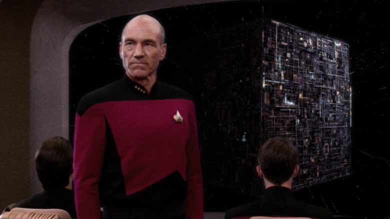 Picard stands in front of the viewscreen