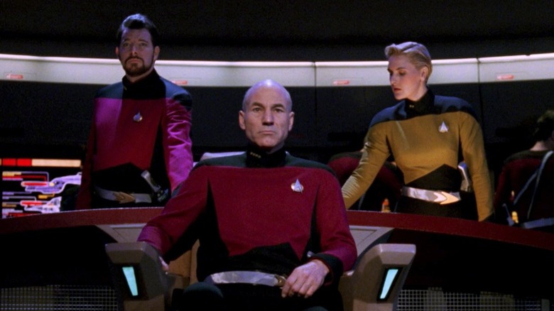 Picard sits on the bridge with Riker and Yar