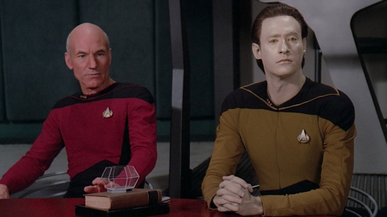 Picard and Data sit at a table