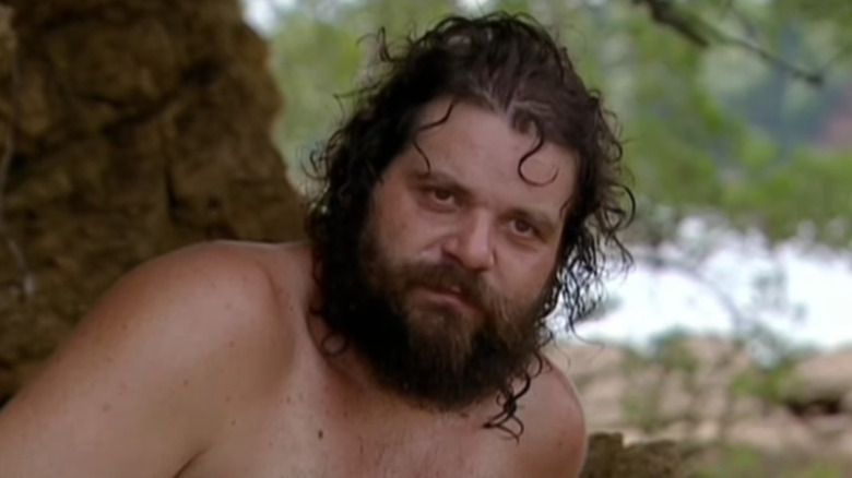 Shirtless Rupert Boneham talking